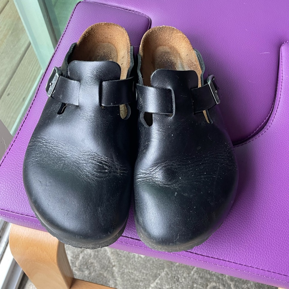 Black leather Birkenstock slides